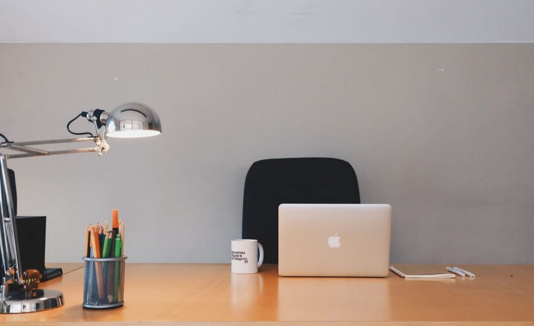 A tidy desk with a closed laptop