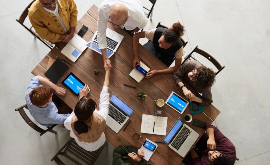 A team working around a table seen from above