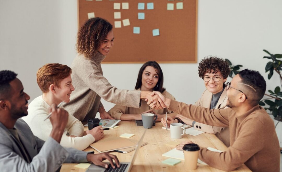 A project team talking through a plan around a table