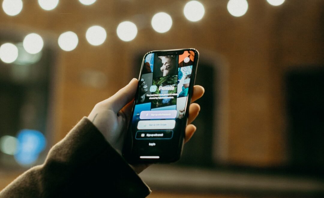 A person scrolling a social feed on a phone