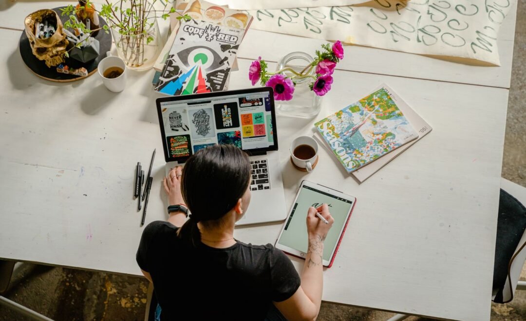 A designer workspace with sketches and colour swatches