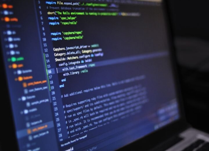 Colourful code on a screen in a dark room