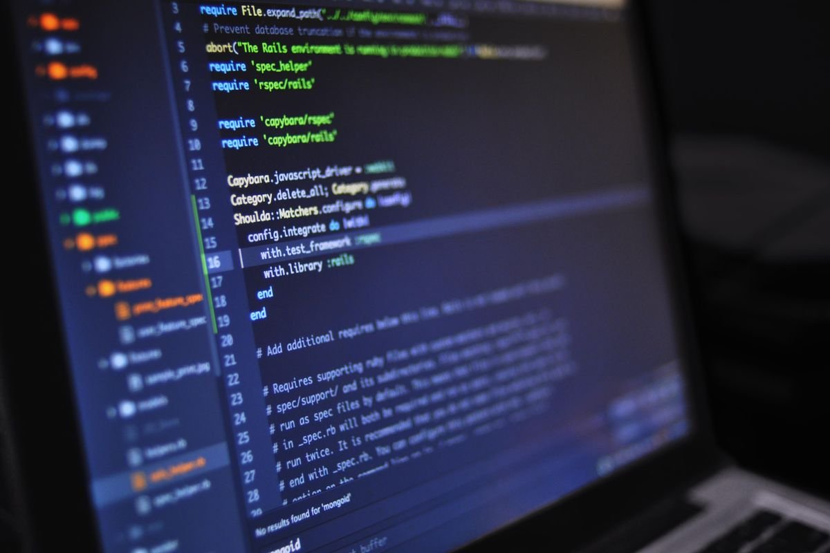 Colourful code on a screen in a dark room