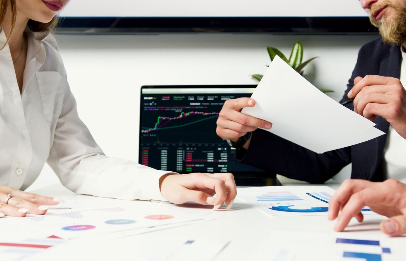 Reviewing social media performance charts on a tablet