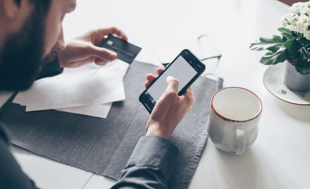 Paying for an online order with a card and a phone