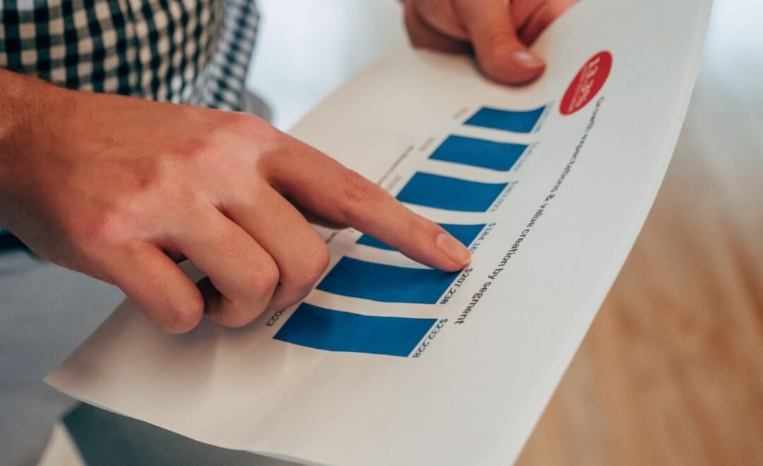 Pointing to a printed performance chart during a review